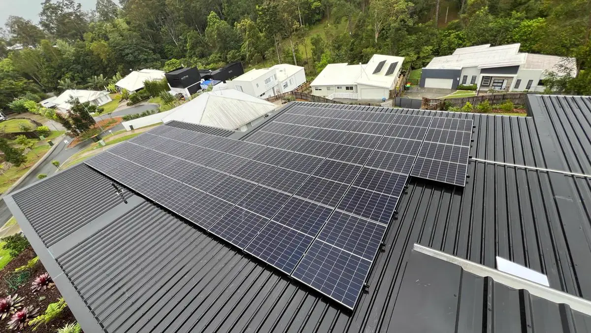 Black solar panels on a Colorbond roof in the Sunshine Coast hinterland