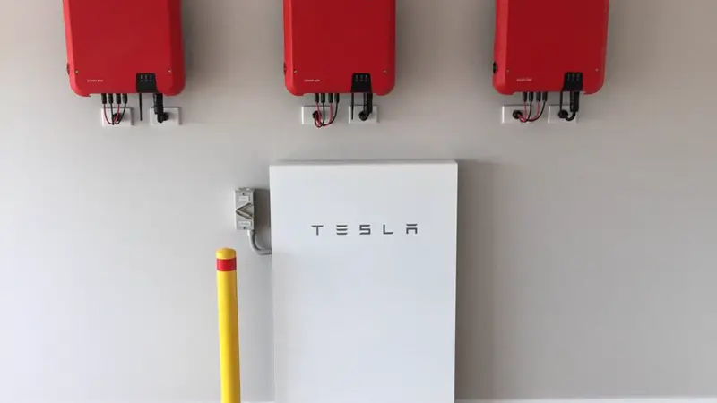 Tesla Powerwall installed on a garage wall